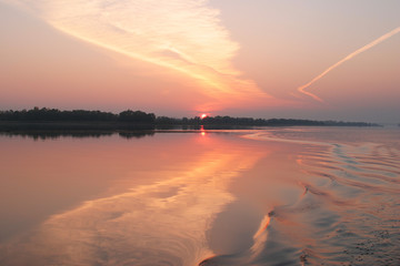 Obraz premium sunset on the river