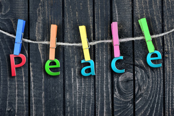 Peace word hanging on clips