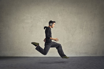 Running boy wearing headphones