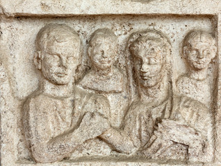 Relief on the ancient sarcophagus in the baths of Diocletian in Rome. Italy