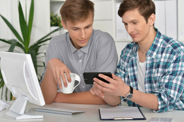 Fototapeta premium portrait of handsome men with computer 