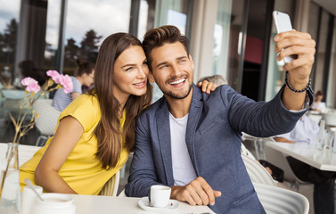 Sexy couple taking photo