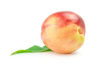 Nectarine fruit with leaf isolated on white background