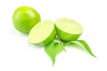 Fresh lime with two half and leaves Isolated on white background