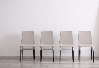 Set of chairs in light room interior