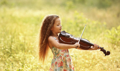 Beautiful girl playing violin