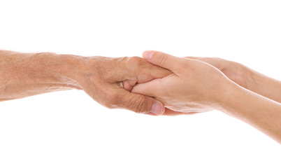 Old male and young female hands on white background