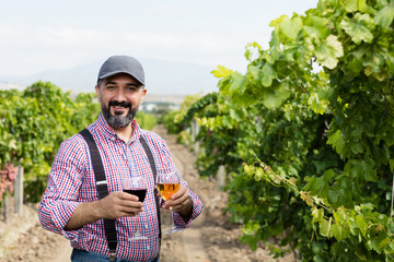 Farmer in vineyard.