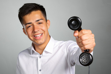 young casual happy man on the phone