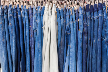 Clothes on clothes rail in clothing store