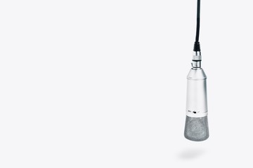 An isolated studio microphone on a white background