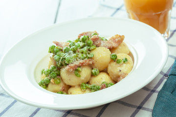 Potato dumplings with fried onion and bacon