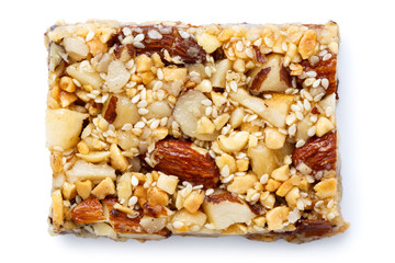 Nut and seed bar with Brazil nuts isolated on white from above.