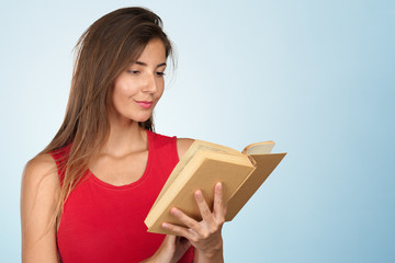 Young woman with a books pile