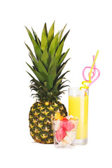Pineapple, a glass of pineapple juice and pieces of fruit isolat