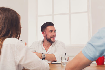 Obraz premium Business meeting. Young hipster businessman in modern office