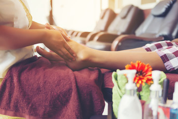 Obraz na płótnie Canvas Thai foot massage alternative medicine therapy with Thai herb ar