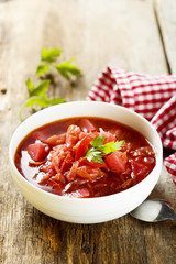 Beetroot soup in white bowl