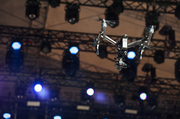 Drone flies over stage/Drone with camera flying over the scene and shoots video