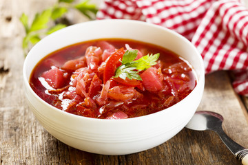 Beetroot soup in white bowl