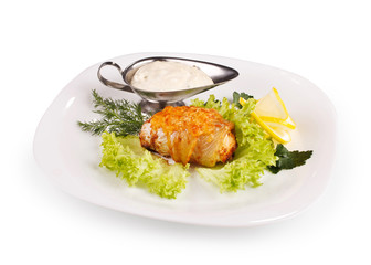 meat  with sauce on a white plate