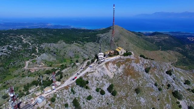 Mount Pantokrator Corfu top mountain summit Greece aerial 4k video panoramic. Peak communications technology station.