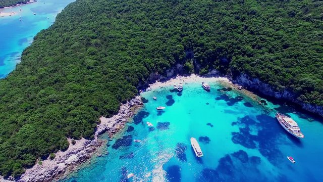 Tropical Ionian Greece island aerial 4k travel video. Ocean sea forest coast seashore, beach harbor bay, blue water, yacht boat