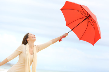 Playful girl joking with umbrella