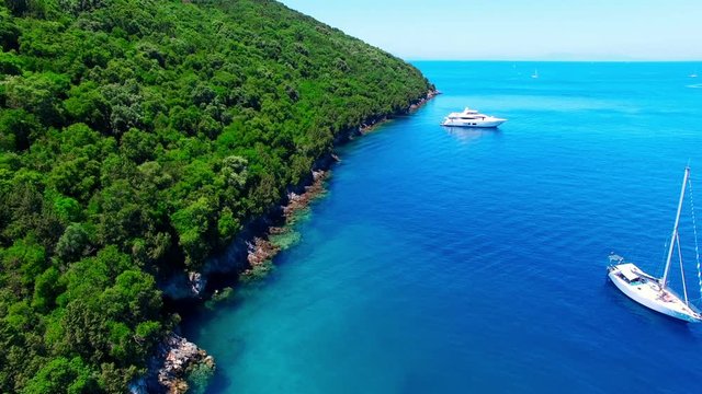 Tropical Ionian Greece island 4k travel video. Ocean sea forest coast seashore, blue water, yacht boat