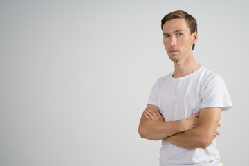 Man Standing with Arms Crossed on Chest