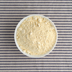 French vanilla cake mix top view on a striped tablecloth.