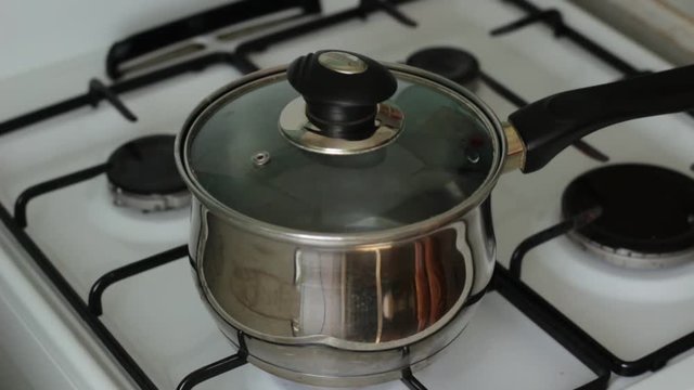 Man touching a hot pan