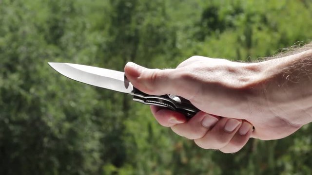 Man demonstrates penknife
