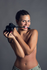 Obraz premium Beautiful young woman with vintage camera