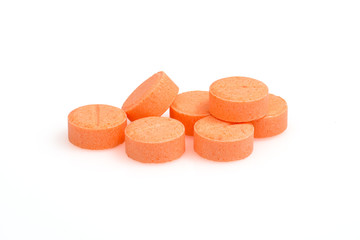Orange color pills close up macro photography drug on  white background