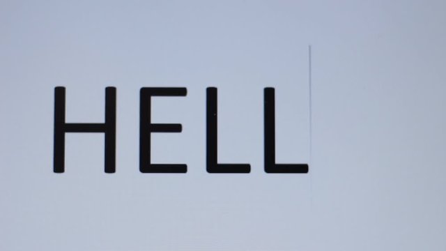 Somebody prints "Hello" on a computer