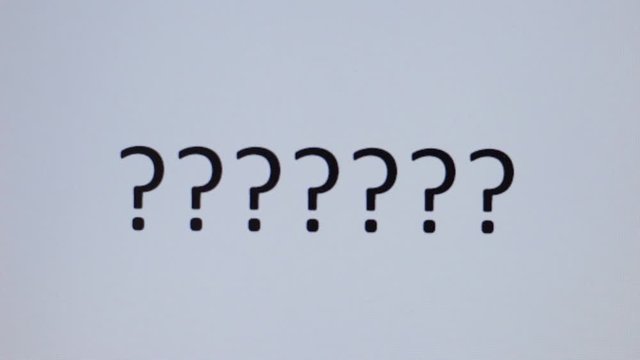 Somebody writes question mark on a computer