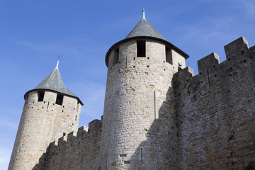 Fototapeta na wymiar two towers and their walls in Carcassonne city, France