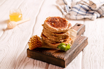 pancakes with honey, decorated mint for breakfast, horizontal