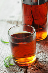 Small shot glass of alcoholic beverage or medical tincture