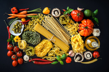 Italian food ingredients on slate background
