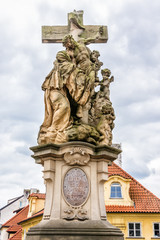 Fototapeta na wymiar Statue on Charles Bridge (Karluv most, 1357). Prague, Czech Rep.