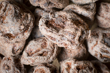 close up salted plum fruit as a background