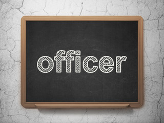 Law concept: Officer on chalkboard background