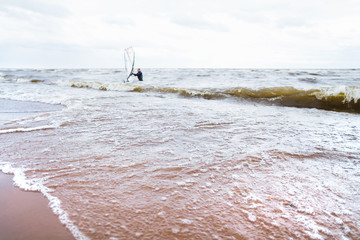 View of storm seascape. Windsurf board