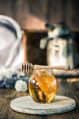 Honey jar and beekeeper tools