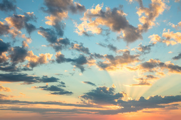 Sunrise sky, gentle colors of soft clouds and sunshine with rays - obrazy, fototapety, plakaty