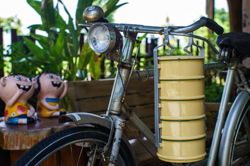Thai food carrier and old bicycle