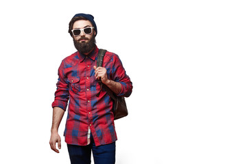 Bearded tourist. Handsome young man carrying backpack