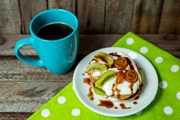 Breakfast with pancakes and coffee on table